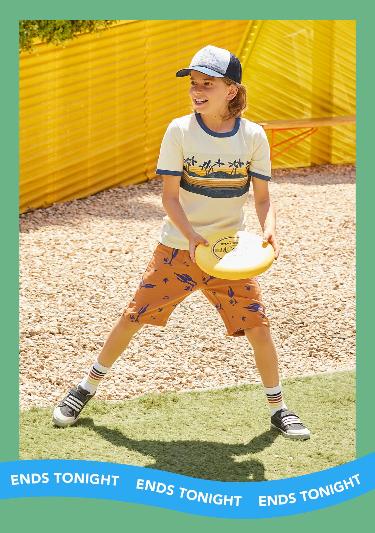 Boy wearing Stevie sneakers, playing frisbee