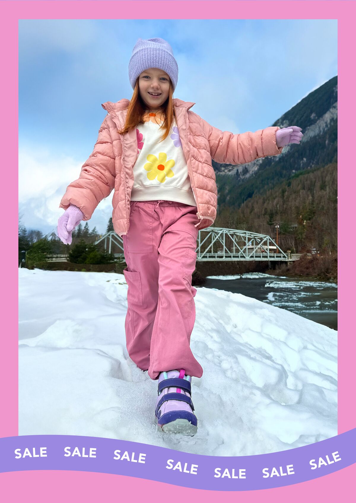 Girl walking in the snow, wearing winter boots