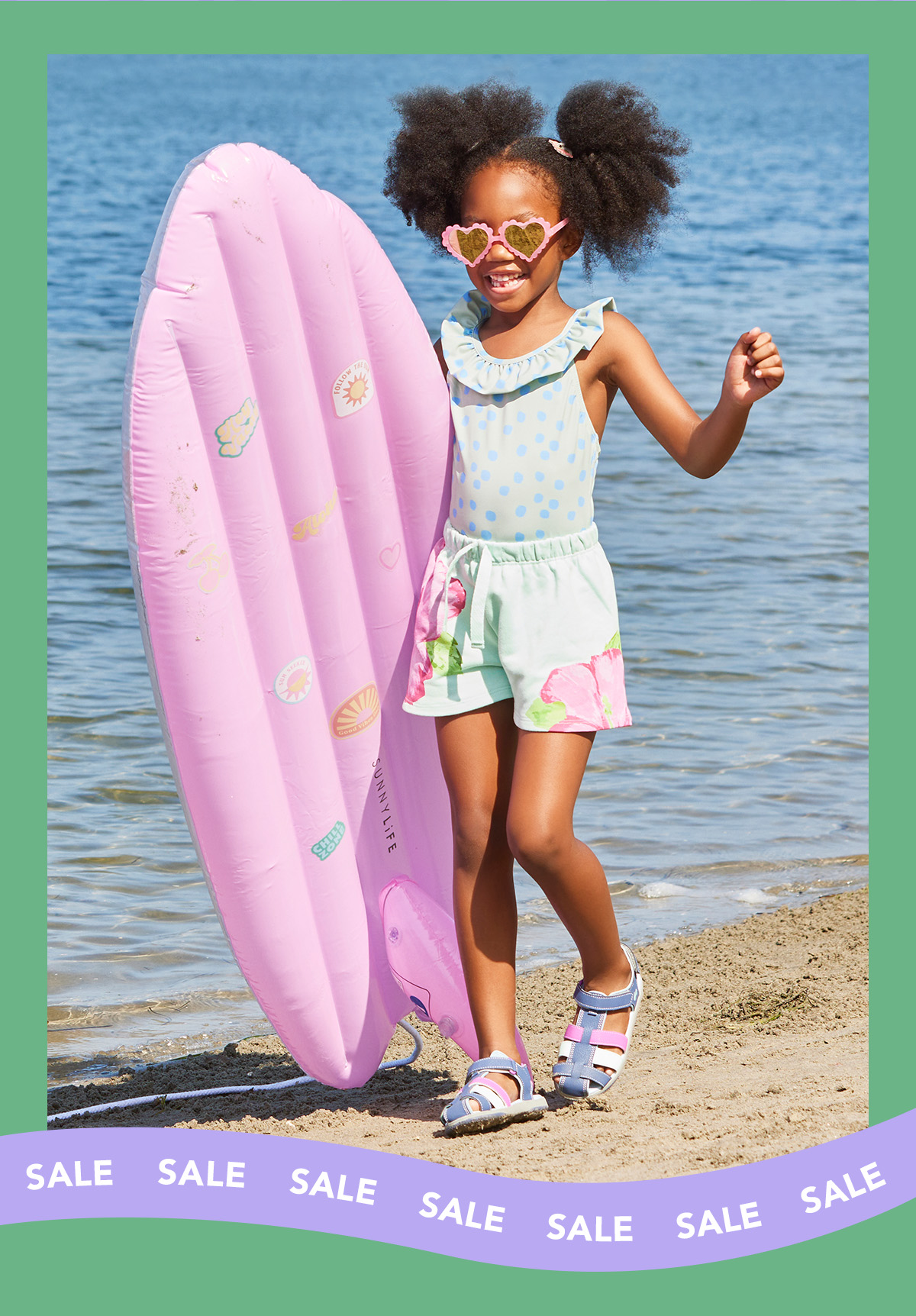 Girl on the beach, wearing Paley sandals